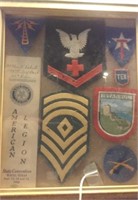 Framed collection of old military patches + more
