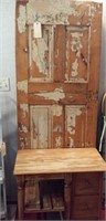 Unique old hall tree made of rustic vintage door