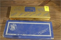 2 Smith & Wesson Boxes with some Pistol Barrel