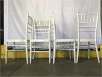 4 white metal chairs