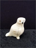 Ivory carving of an owl with a baleen beak, fossil