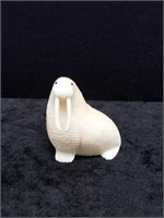 Ivory carving of a walrus with inset baleen eyes b