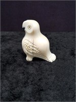 Fossilized ivory carving of an owl with fossilized
