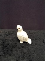 Fossilized ivory carving of an owl with fossilized