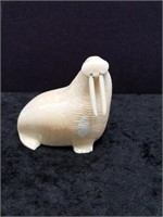 Ivory carving of a walrus with inset baleen eyes b