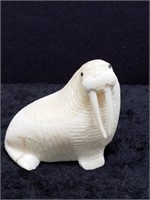 Ivory carving of a walrus with inset baleen eyes,