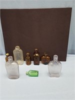 Lot of 9 antique bottles, blue, green, and amber