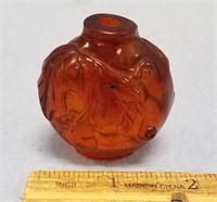 Amber colored cast snuff bottle