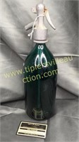 Green seltzer bottle