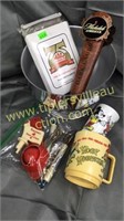 Group with beer tap handles, MAC flask,