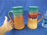 2 large signed pottery mugs or pitchers -9in tall