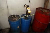 Lot:  2 oil dispensing barrels and 1 pump