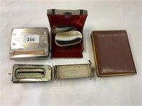 QTY OF ITEMS INCLUDES - CIGARETTE ROLLER, BRUSH