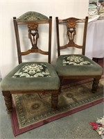 A PAIR OF GREEN UPHOLSTORED NURSING CHAIRS