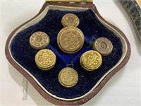 BOXED SET OF 7 ASSORTED BRASS BUTTONS AND 3