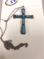 Turquoise and silver cross on a nice silver