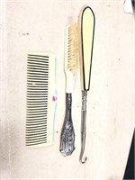 Brush with sterling silver handle, decorated comb