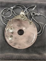 Rose quartz pendant trimmed in sterling silver on