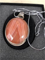 Banded agate set in sterling silver with a chain