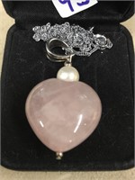 Heart shaped rose quartz pendant with a pearl on