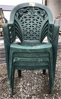 Stack of plastic chairs - green