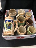 Nine beer mugs very decorative. one is from the
