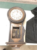 Big wall clock with a fancy oak case, has chimes,