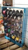 Rack w/ 22 partial spools asst electrical wire
