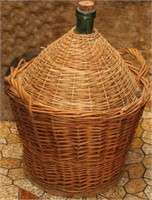 Large glass bottle in wicker basket, 28"H x 20"Dia