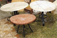 2 oval white marble tables with iron bases