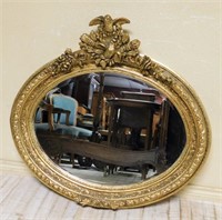 Bird Crowned Gilt Framed Oval Beveled Mirror.