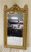 Acanthus and Floral Swag Gilt Beveled Mirror.