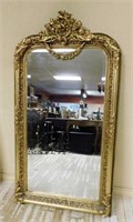 Rococo Flourish Crowned Gilt Beveled Mirror.