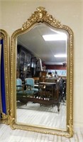 Cartouche and Foliate Crowned Gilt Beveled Mirror.