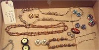 4 ;necklaces 7 pr earrings, 1 pin amber tones