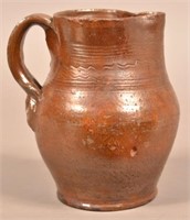 Glazed Redware Pitcher with Incised Decoration.