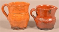 Two Glazed Redware Pottery Pitchers.