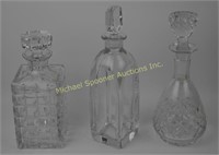 THREE CRYSTAL AND GLASS DECANTERS