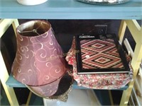 Quilt topper, book, dresser mirror and lamp shade