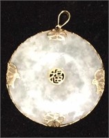Jadeite pendant set in gold