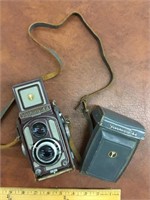 Yashika-44 camera with leather case and strap.