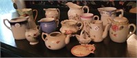 Painted miniature porcelain pitchers