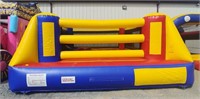 Boxing ring bounce house with two sets of boxing
