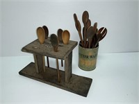 Lot of primitive wooden spoons with stand