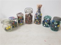Lot of 7 jars filled with marbles