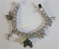 STERLING SILVER CHARM BRACELET WITH FIVE CHARMS