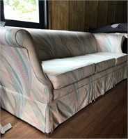 Peach green print sofa