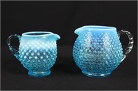 Two Fenton Blue Opalescent Hobnail Pitchers