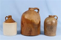 Three Stoneware Jugs in Graduated Sizes