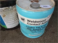 Partial Cans of Adhesive and Kerosene